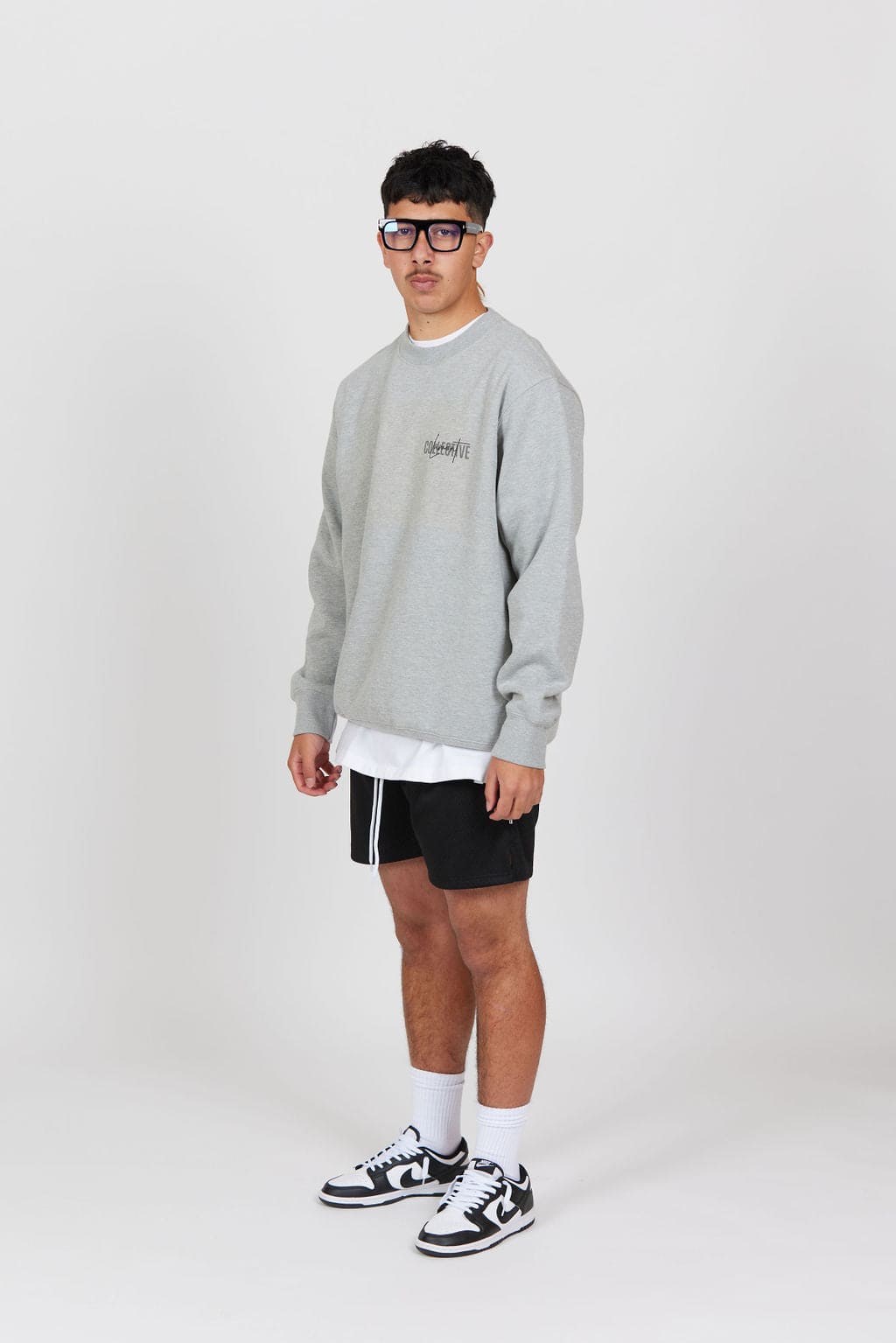 Front view of Male model wearing the Grey Marl Collective Crew Neck Top